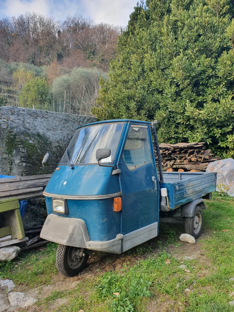 Blue vintage trike called Piaggio Ape in Italy