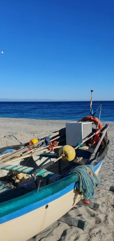 Shipping boat on beach in Noli